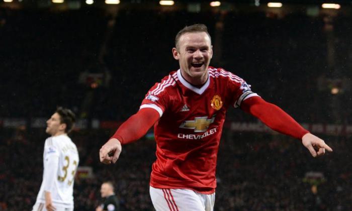 英超联赛：Wayne Rooney抢夺曼彻斯特联队和阿森纳在顶部举行两点